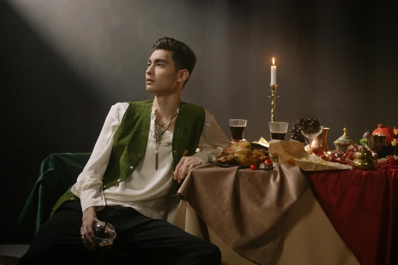 a man sitting at a table with a glass of wine, an album cover, inspired by Georges de La Tour, trending on pexels, renaissance, cai xukun, medieval high fashion, fashion shoot 8k, vests and corsets