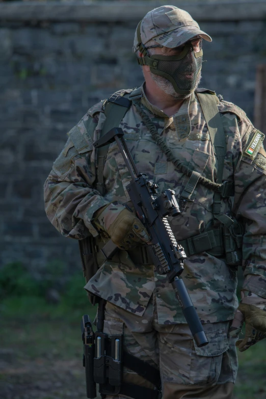 a man in camouflage is holding a gun, by Adam Marczyński, reddit, 6 0 mm lens in full armor, not cropped, multicam, chris tulloch mccabe