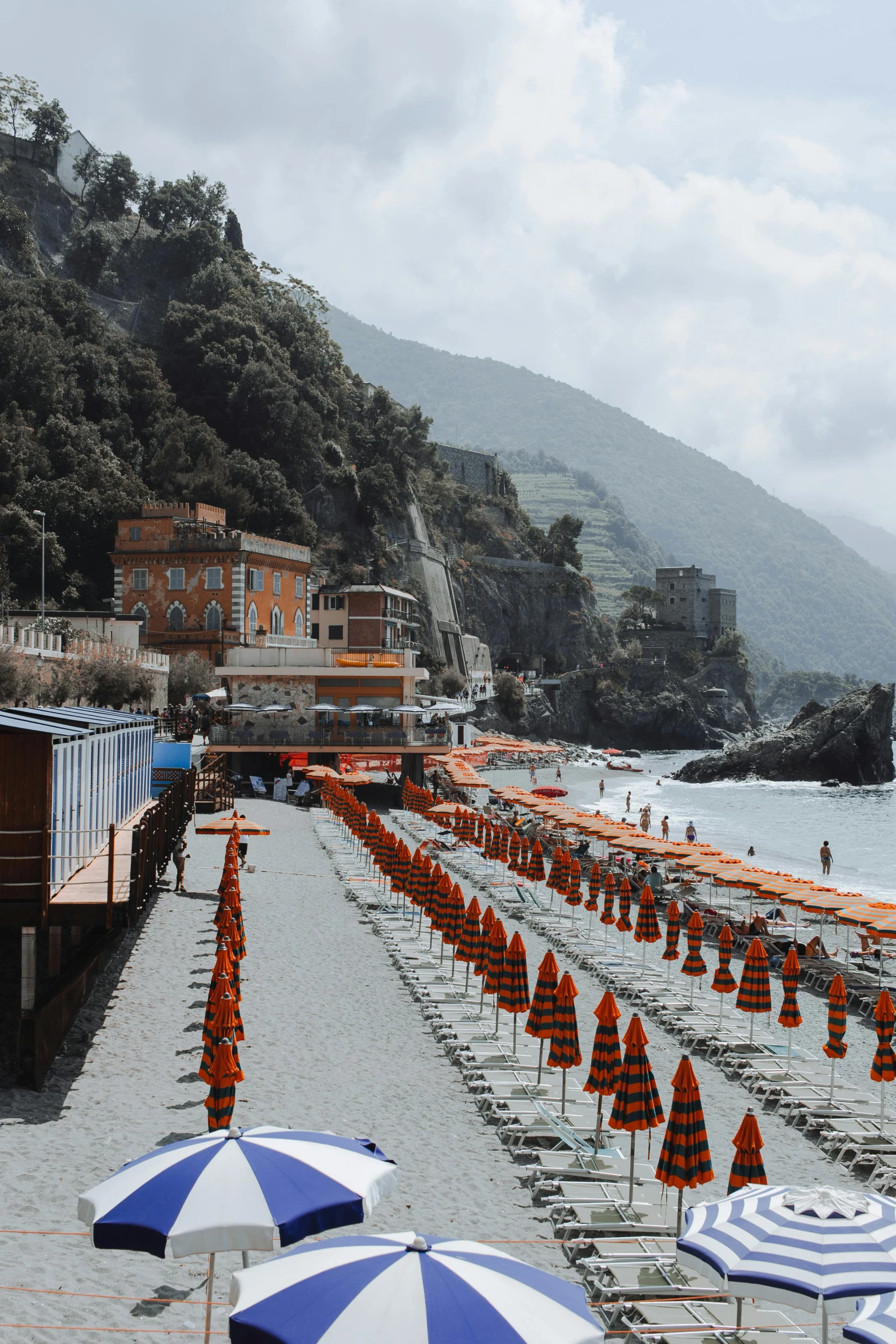 a beach filled with lots of blue and white umbrellas, by Carlo Martini, pexels contest winner, renaissance, grey orange, cliffside town, boardwalk, 2 5 6 x 2 5 6 pixels