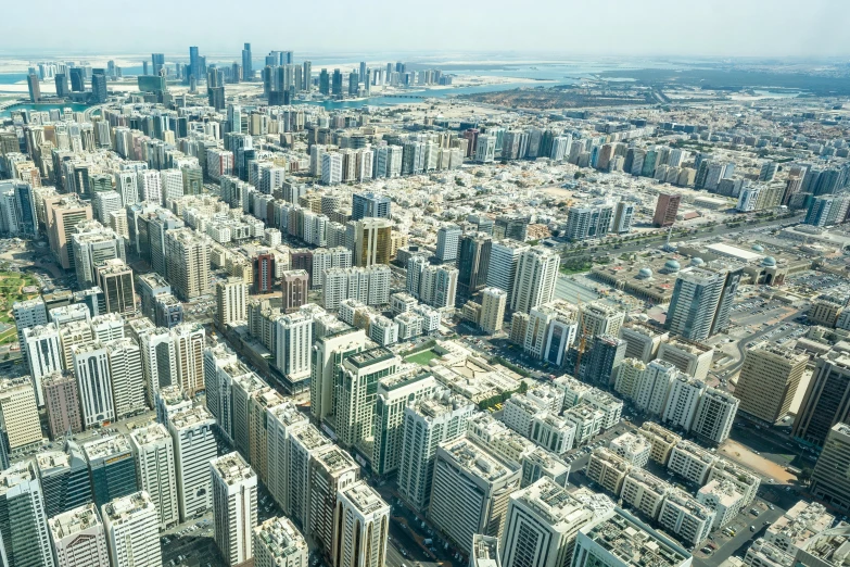 a large city filled with lots of tall buildings, pexels contest winner, hurufiyya, dezeen, gulf, flat, birdseye view