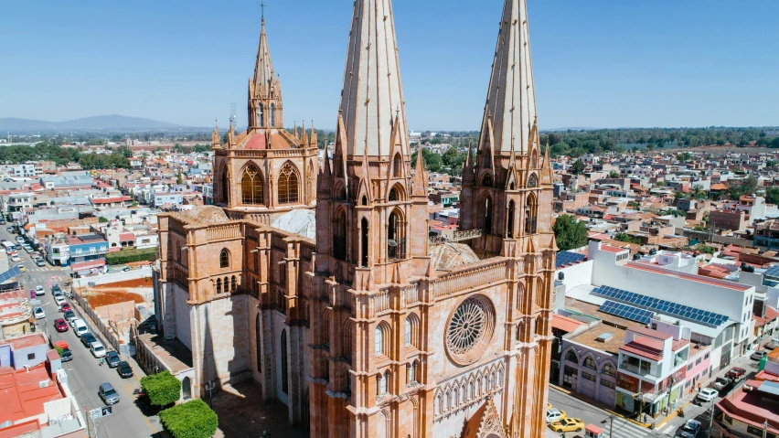 a large cathedral in the middle of a city, by Matteo Pérez, pexels contest winner, hyperrealism, drone footage, rafeal albuquerque, pink marble building, avatar image