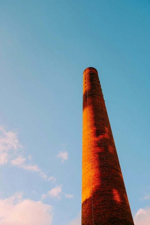a tall brick chimney sitting in the middle of a field, unsplash, minimalism, art deco factory, single long stick, warm colors, ceramics