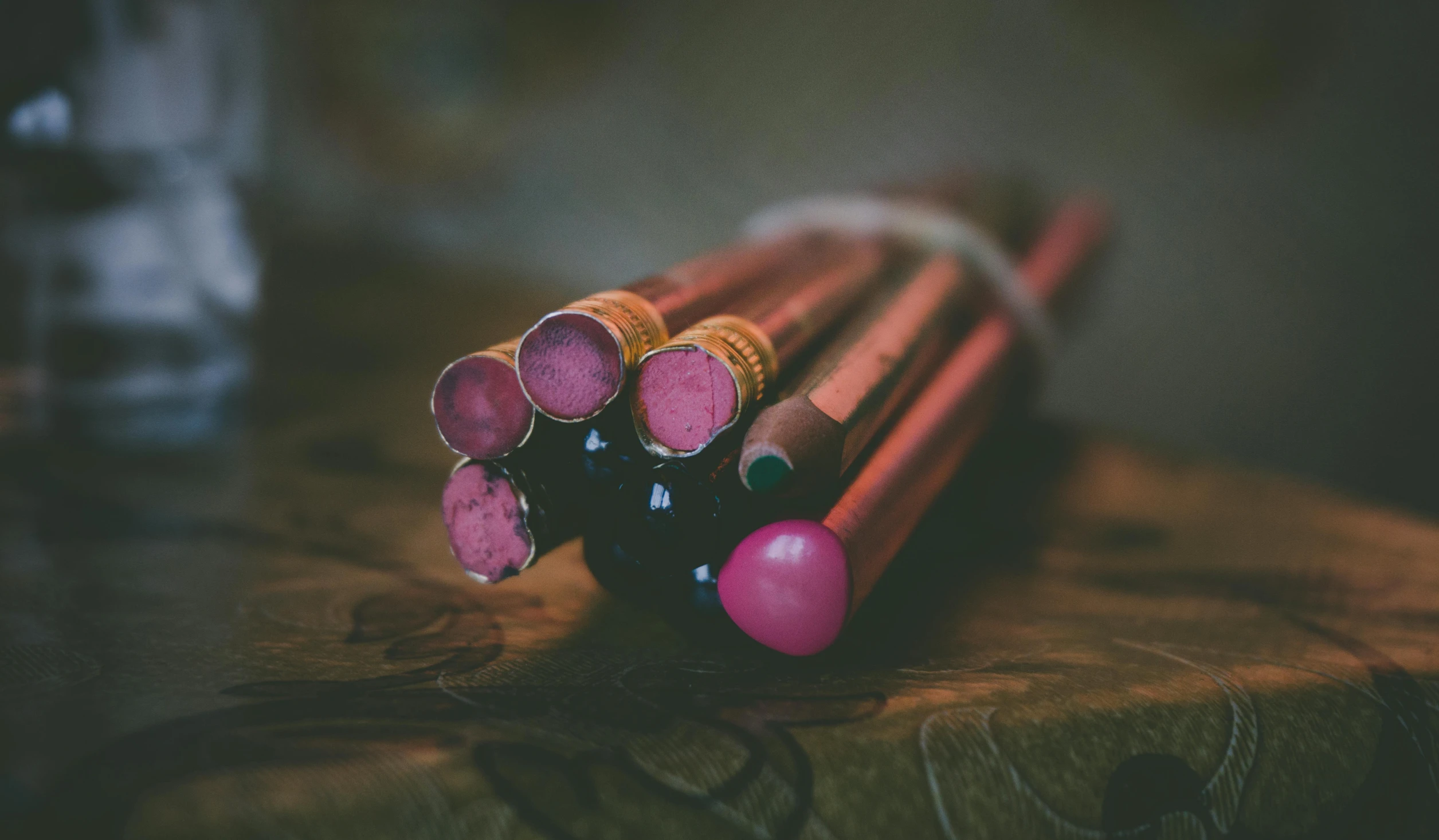 a bunch of pencils sitting on top of a wooden table, pexels contest winner, brown and magenta color scheme, healing tubes, portrait photo, old paints