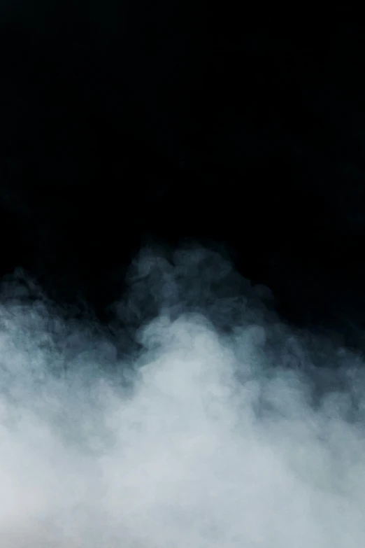 a man riding a snowboard down a snow covered slope, by Adam Marczyński, pexels, conceptual art, background ( smoke, an abstract, gothic fog, with smoke
