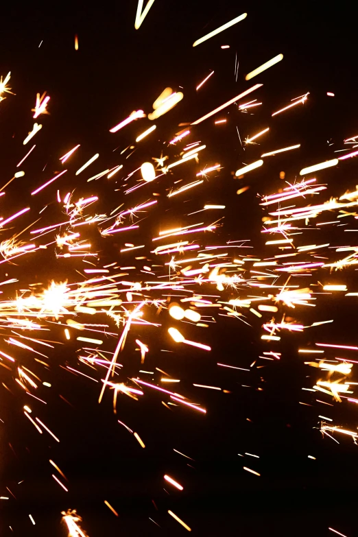a close up of a person holding a sparkler, by Daniel Lieske, kinetic art, welding torches for arms, 4 k, lots of stars, explosions!