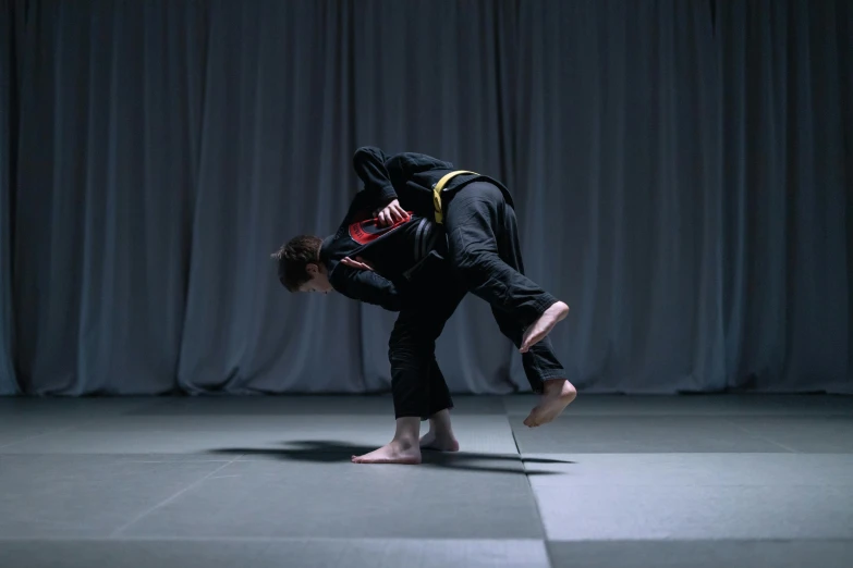 a man that is standing in the middle of a floor, fighting posture, alessio albi and shin jeongho, still frame, origin jumpworks