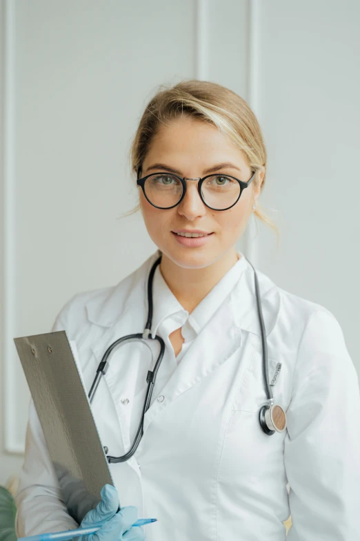 a female doctor with a stethoscope in her hand, a picture, by Adam Marczyński, pexels contest winner, modernism, with square glasses, mid body, white, good looking face