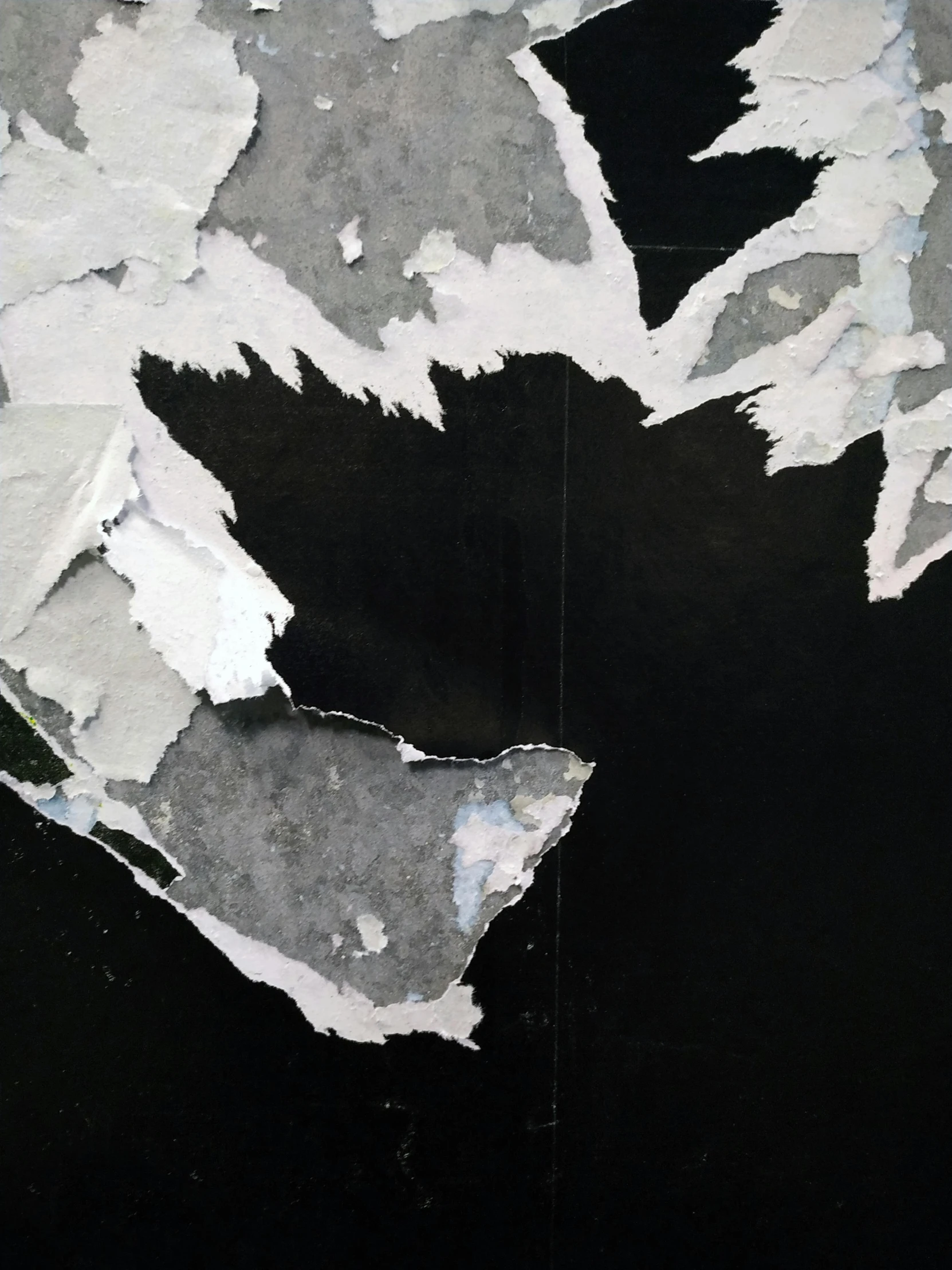 a piece of torn paper sitting on top of a table, an album cover, inspired by Alberto Burri, reddit, detail, dark paint, satellite photo, 15081959 21121991 01012000 4k