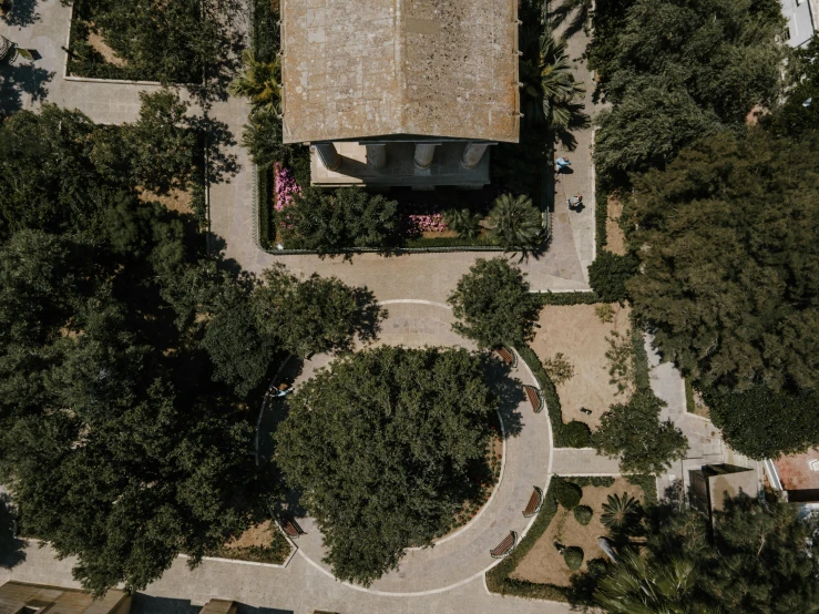 an aerial view of a house surrounded by trees, an album cover, by Carlo Carrà, pexels contest winner, formal gardens, empty streetscapes, cyprus, well shaded