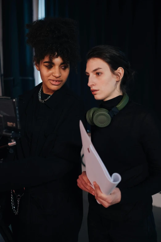 a couple of people standing next to each other, behind the scenes, androgynous person, charli bowater, high quality upload