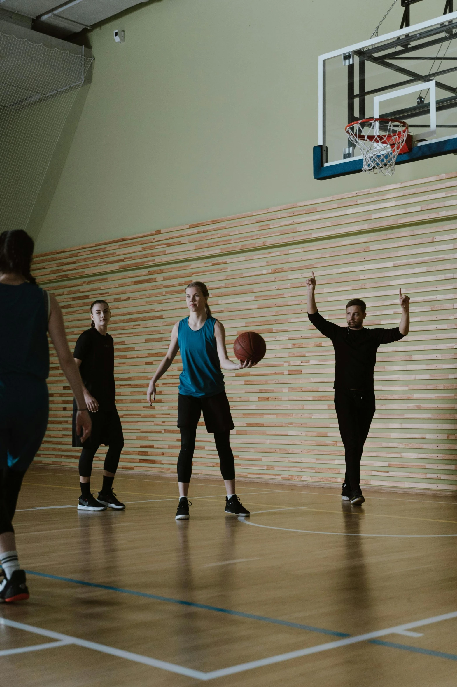 a group of people playing a game of basketball, aleksandra waliszewska, game ready, in a medium full shot, high quality upload