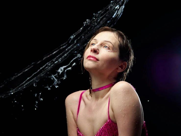 a woman in a pink dress with water coming out of her head, by Julia Pishtar, drooling ferrofluid. dslr, greta thunberg as gollum, posing in dramatic lighting, under a shower