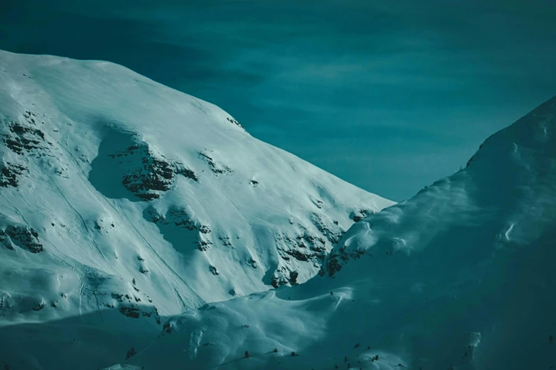 a man riding a snowboard down the side of a snow covered mountain, pexels contest winner, fantastic realism, teal aesthetic, paul barson, mountain scape. film still, 4k hd wallpaper:4