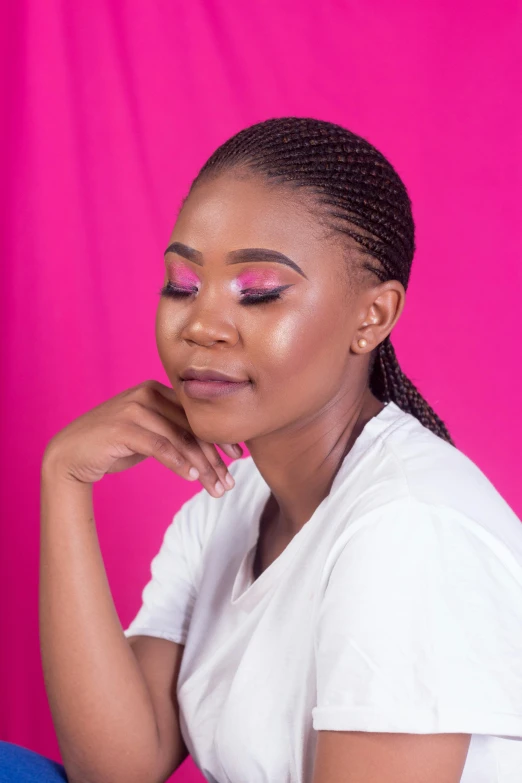 a woman sitting in front of a pink backdrop, inspired by Cosmo Alexander, featured on instagram, eyeshadow, ( side ) profile, closeup headshot, clean background