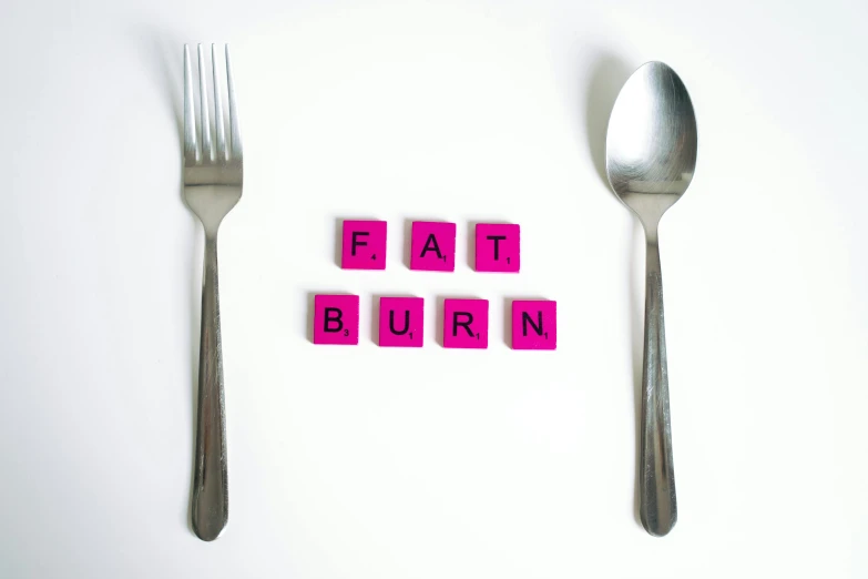 a fork and spoon with the word fat burn spelled on it, an album cover, purism, cubes on table, pink, hot food, white bg