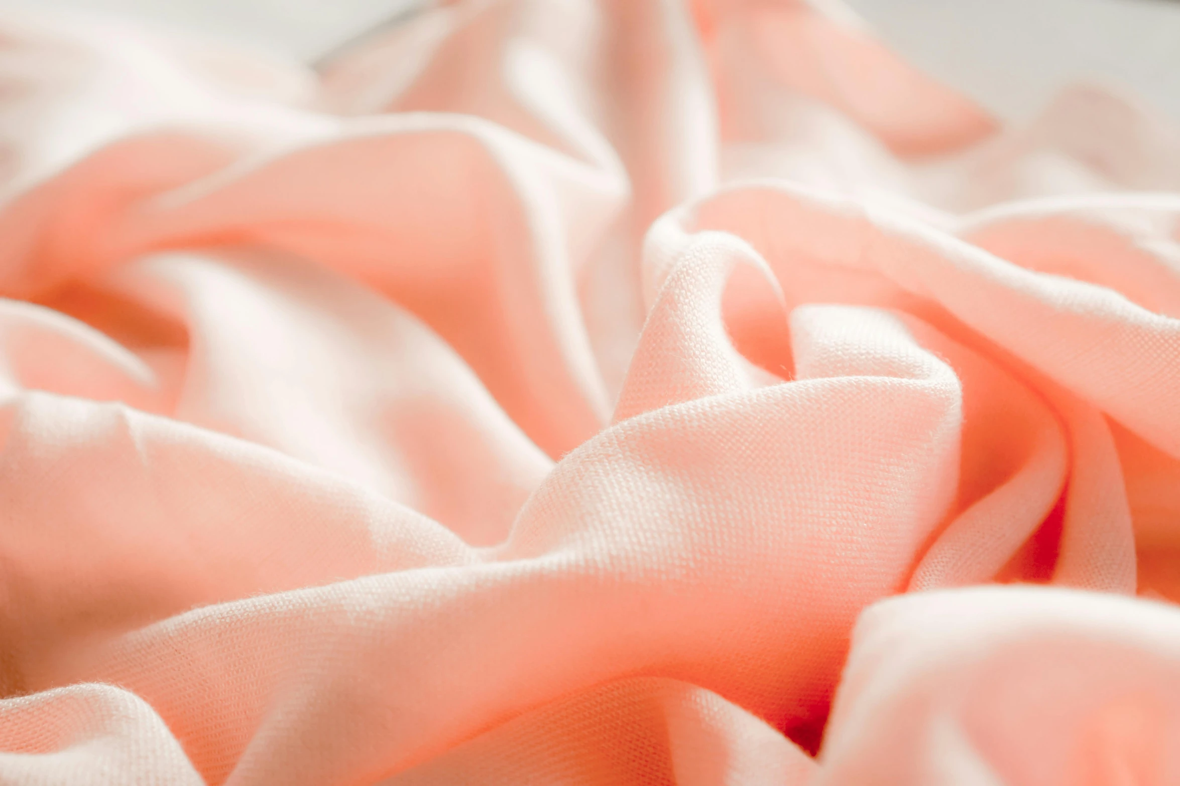 a pile of pink fabric sitting on top of a bed, a macro photograph, by Daniel Gelon, unsplash, fan favorite, bottom body close up, coral, detailed product image