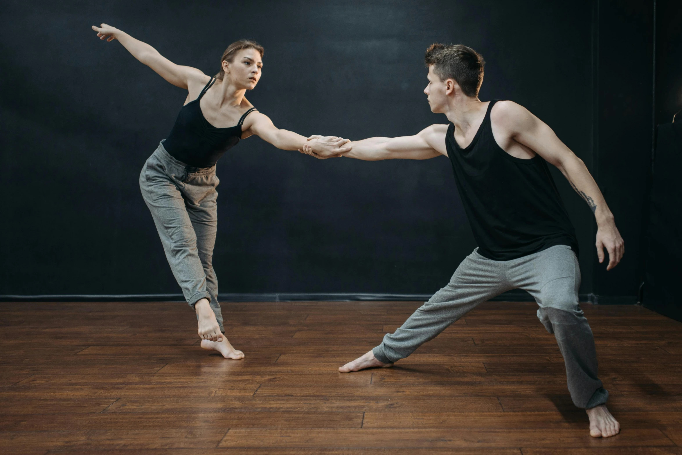 a man and a woman in a dance pose, unsplash, arabesque, ilustration, lachlan bailey, interacting and posing, male and female