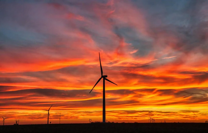 a sunset with wind turbines in the foreground, by Joe Stefanelli, pexels contest winner, red sky blue, epic scale ultrawide angle, full color photograph, “ iron bark