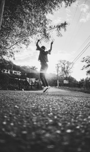 a man flying through the air while riding a skateboard, a black and white photo, by Andrew Domachowski, pexels contest winner, happening, black teenage boy, sundown, 15081959 21121991 01012000 4k, ecstatic