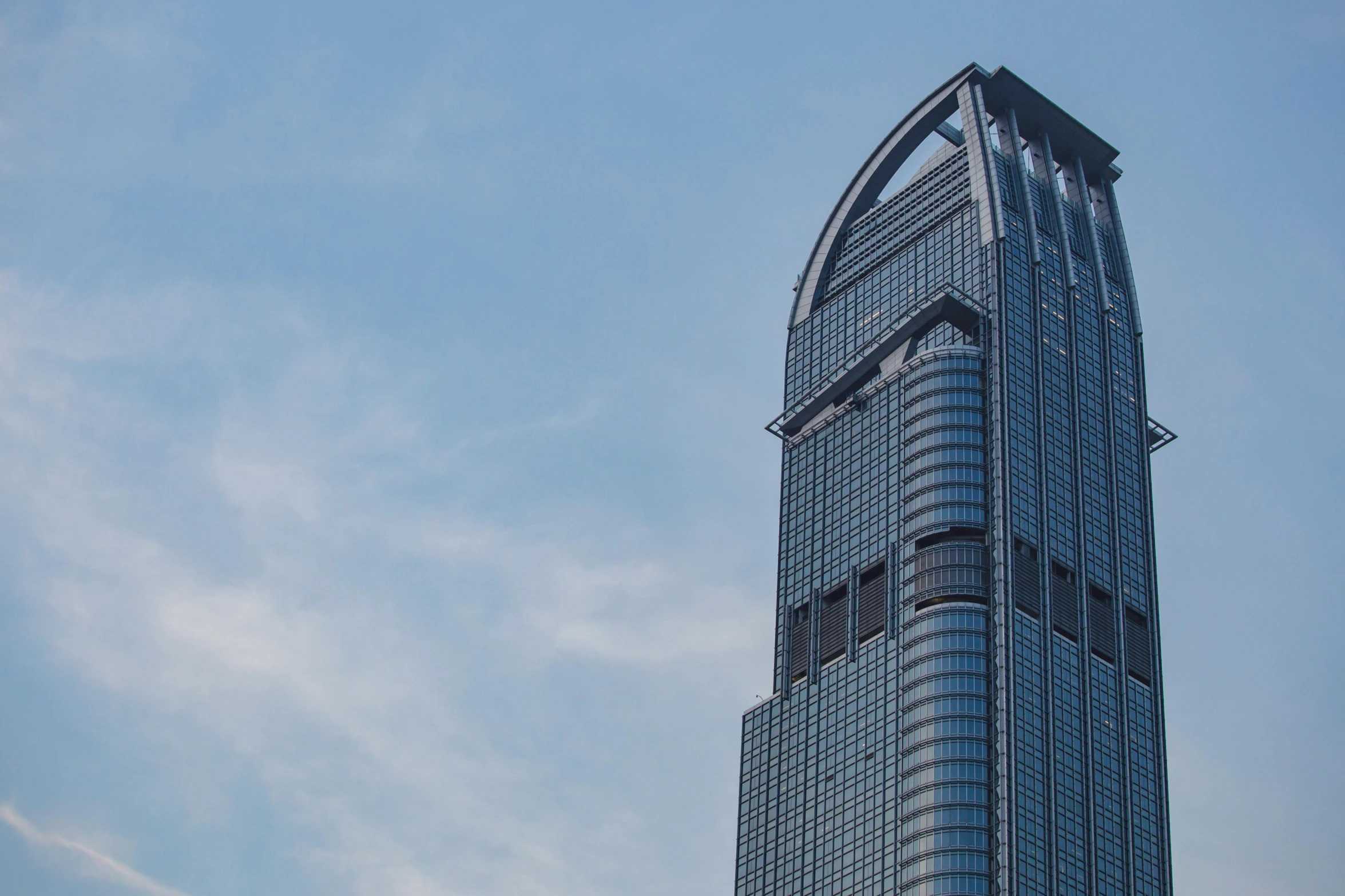 a very tall building with a lot of windows, inspired by Cheng Jiasui, pexels contest winner, gutai group, exterior view, promo image, blue sky, grey