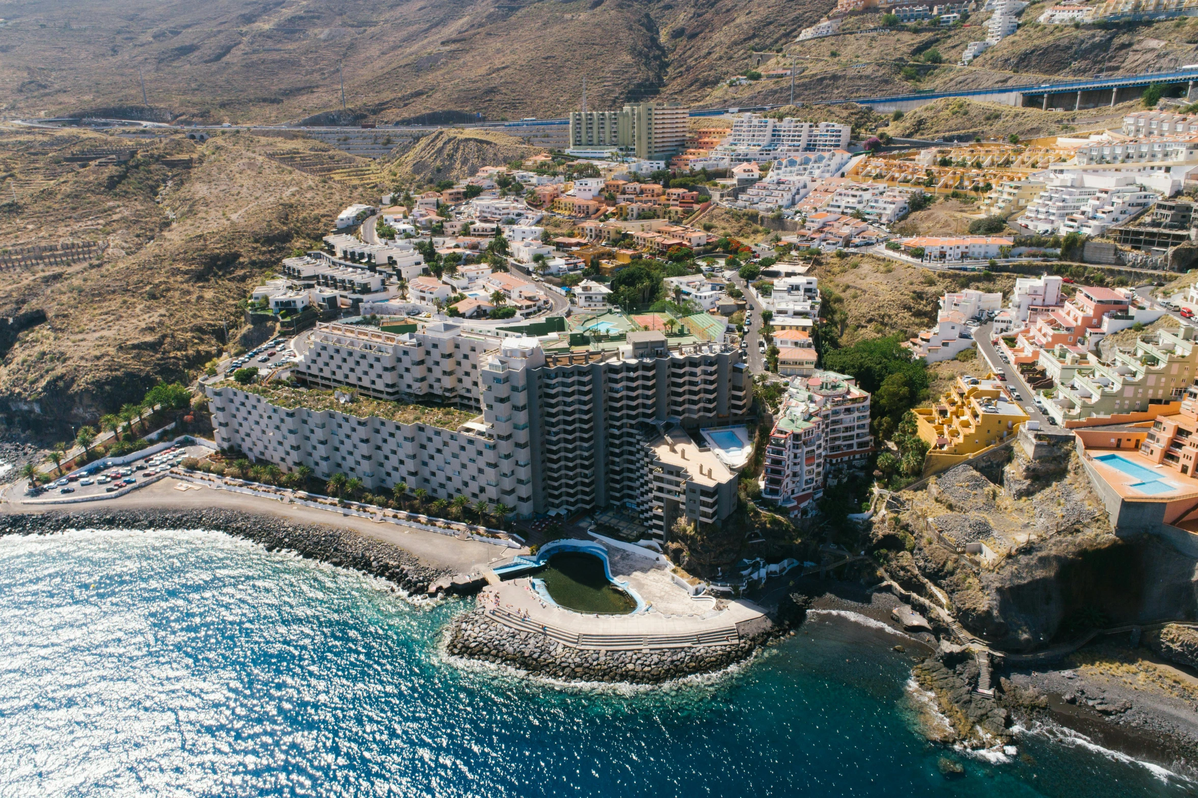 a bird's eye view of a resort in tenerife, tenerife, tenerife, tenerife, teneri, a portrait, high quality upload, on ocean, carson ellis, apartment