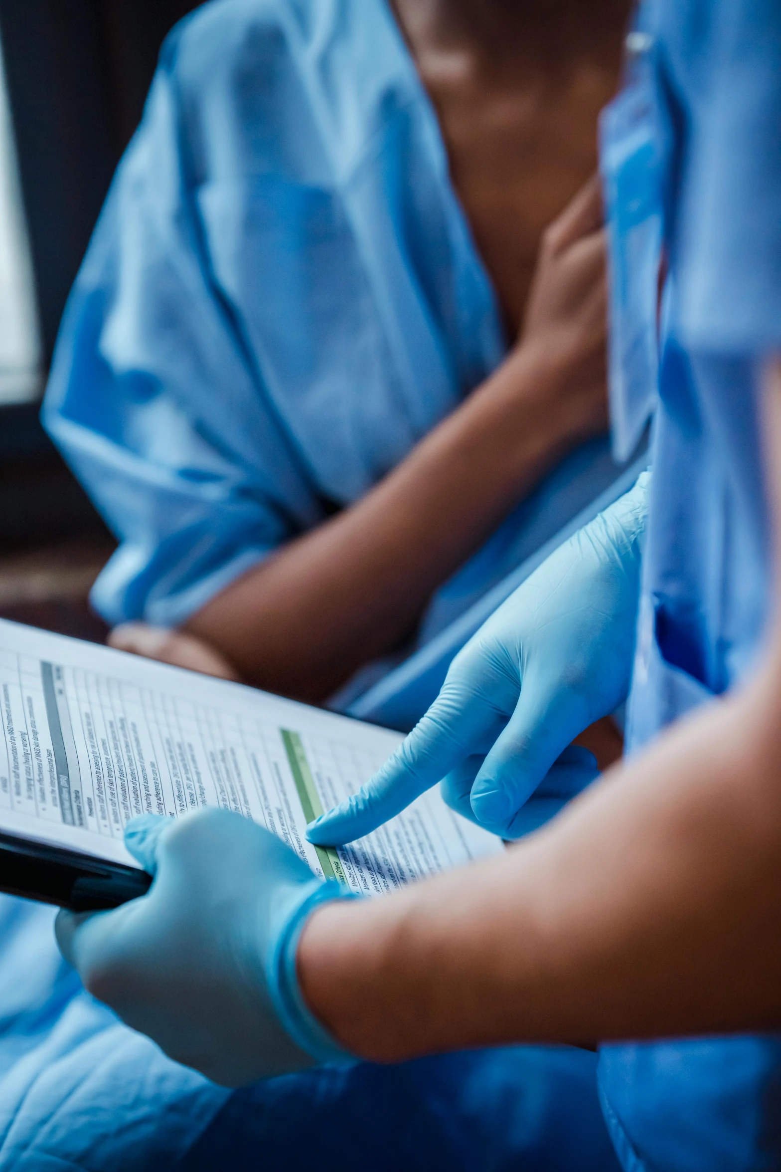 a close up of a person reading a book, surgical gown and scrubs on, thumbnail, viral, charts