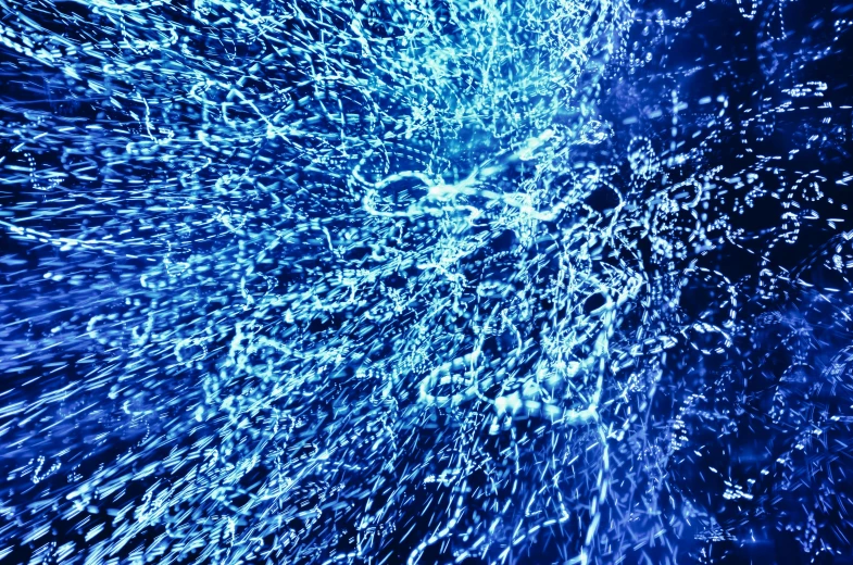 water splashing on the surface of a body of water, a digital rendering, vibrant blue, taken on a 2000s camera, parametric flow, intricate sparkling atmosphere