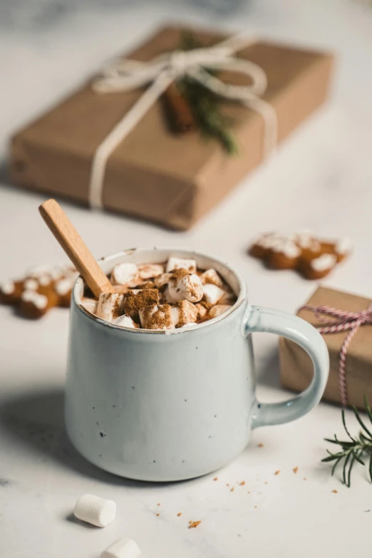 a mug filled with hot chocolate and marshmallows, holiday vibe, caramel, thumbnail, product shot