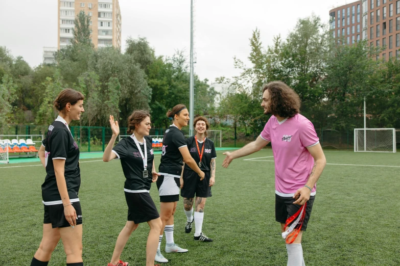 a group of young women standing on top of a soccer field, by Julia Pishtar, danube school, moscow, simona sbaffi is the captain, awarding winning, sebastien chabal