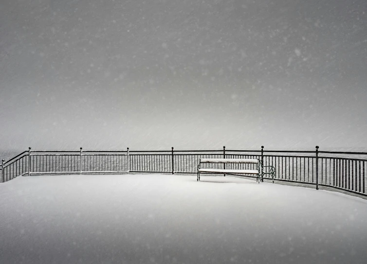 a bench sitting on top of a snow covered ground, peter guthrie, railing, winning photograph, guardrails