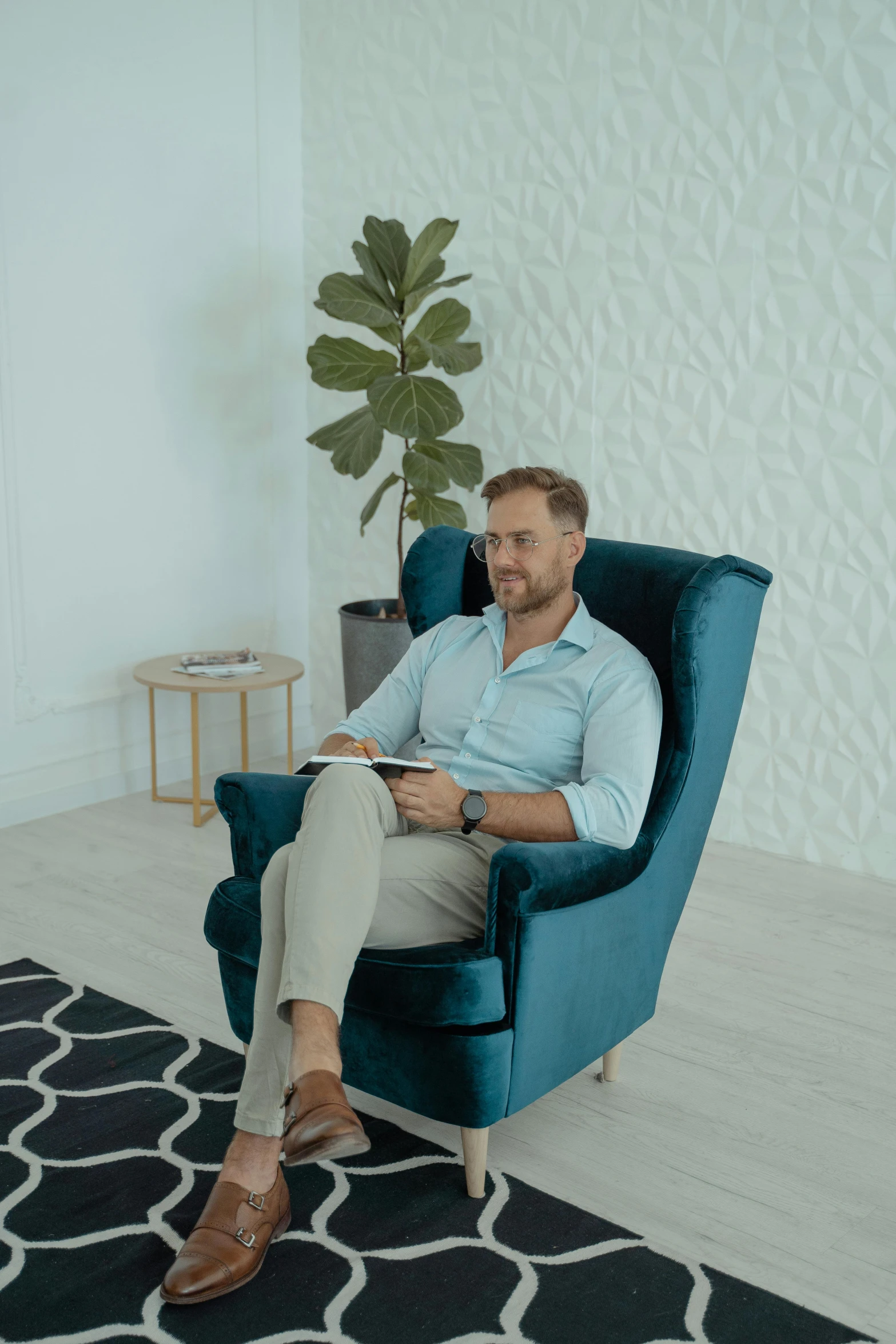 a man sitting in a chair reading a book, calmly conversing 8k, commercial, profile image