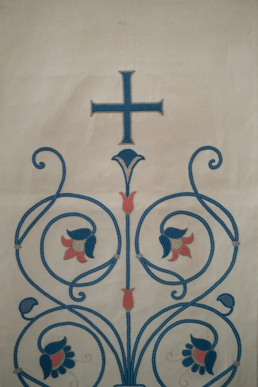 a picture of a cross on a wall, a silk screen, inspired by Lubin Baugin, featured on reddit, arts and crafts movement, blue and red tattoo, 1 6 9 5, painted on silk, the narthex