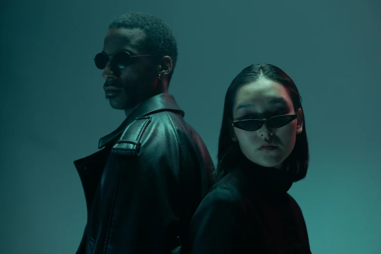 a man and a woman standing next to each other, an album cover, inspired by Zhu Da, trending on pexels, technological sunglasses, diverse outfits, dark tone, blade
