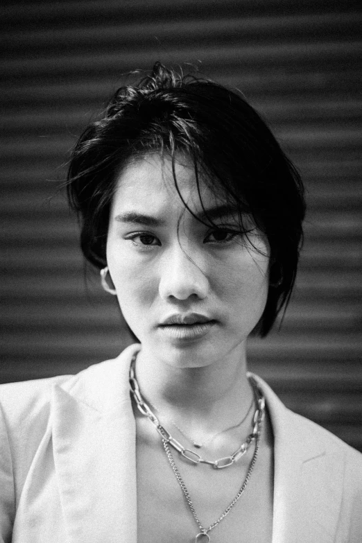 a black and white photo of a woman, inspired by Jung Park, shin hanga, androgynous male, she is about 2 5 years old, '9 0 s, asian human