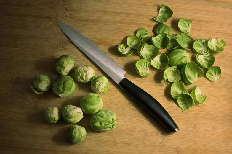 brussel sprouts and a knife on a cutting board, pexels contest winner, hyperrealism, black, modeled, multiple stories, recipe