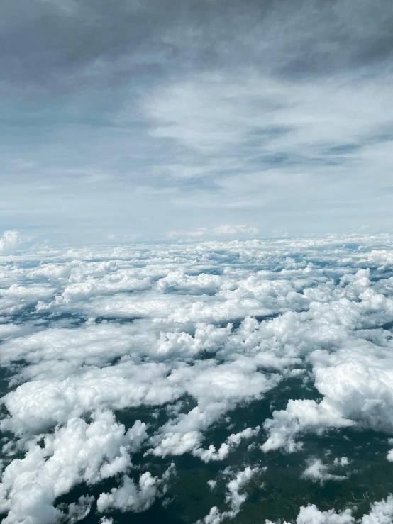 a view of the sky and clouds from an airplane, by Niko Henrichon, trending on unsplash, multiple stories, high view, low angle 8k hd nature photo, beautiful panoramic imagery