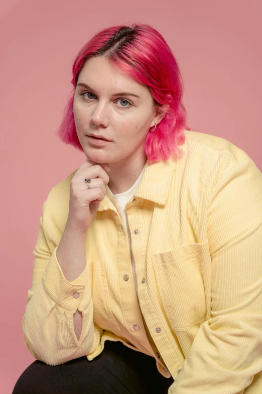 a woman with pink hair posing for a picture, yellow backdrop, sydney hanson, pondering, on clear background