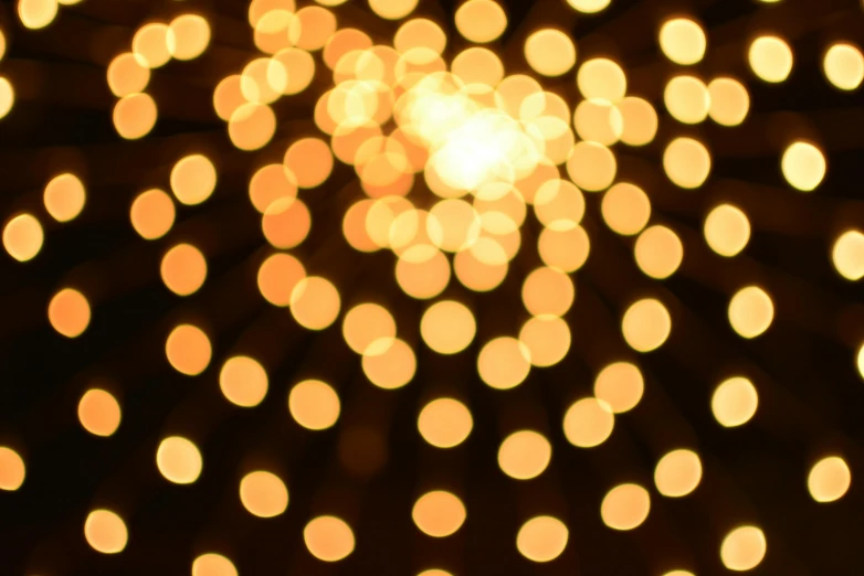 a bunch of lights that are in the dark, by Carey Morris, pexels, light and space, yellowish light, dots abstract, ( ( ( ( volumetric light ) ) ) ), christmas lights