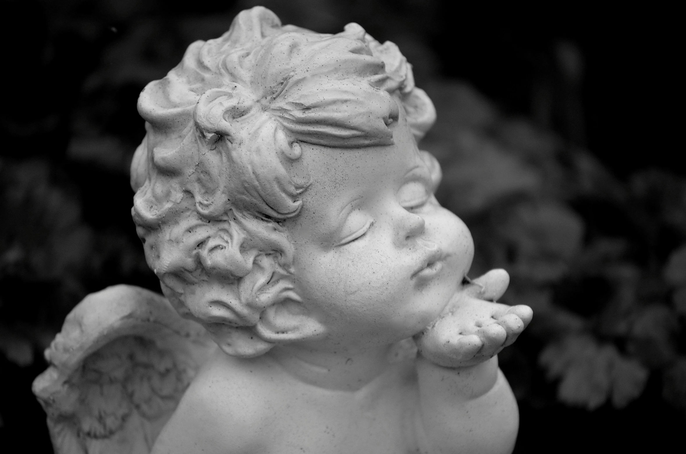 a statue of an angel blowing a kiss, inspired by Margaret Brundage, pixabay contest winner, black and white old photo, closeup of an adorable, sweet dreams, trending photo