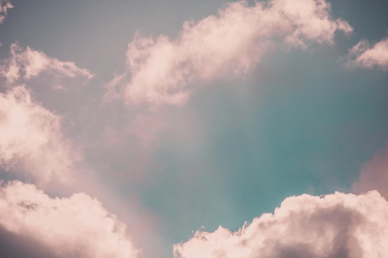 a plane flying through a cloudy blue sky, an album cover, inspired by Elsa Bleda, unsplash, aestheticism, pink pastel, ceremonial clouds, pink and teal, play of light