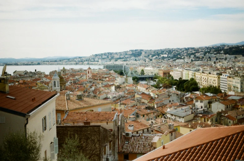 a view of a city from the top of a hill, a photo, by Nathalie Rattner, pexels contest winner, renaissance, nice, shot on hasselblad, sunfaded, wes anderson background