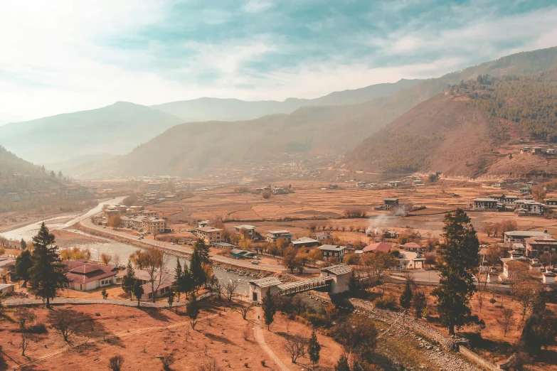 an aerial view of a village in the mountains, pexels contest winner, hurufiyya, bhutan, sunfaded, 🦩🪐🐞👩🏻🦳, an ancient city on fire