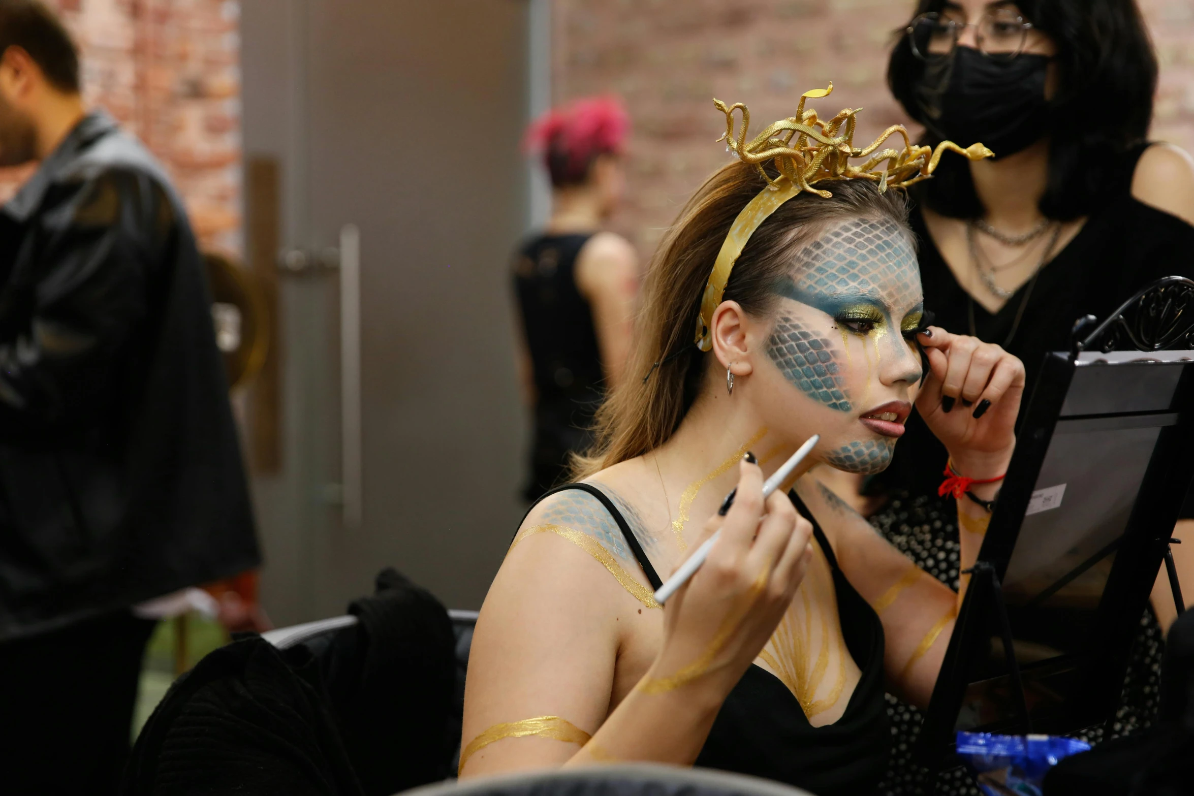 a woman is getting her make up done, process art, wearing a golden crown, dragon queen, promotional photo, thumbnail