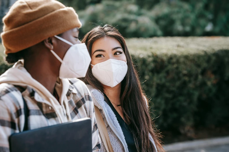 a man and a woman wearing face masks, trending on pexels, diverse, student, background image, beautiful surroundings