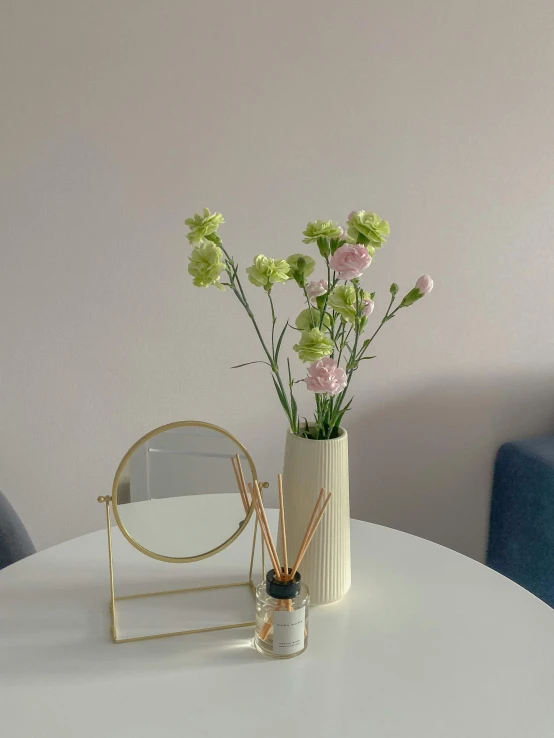 a white table topped with a vase filled with flowers, unsplash, postminimalism, low quality photo, in my bedroom, lime and gold hue, highly detailed # no filter