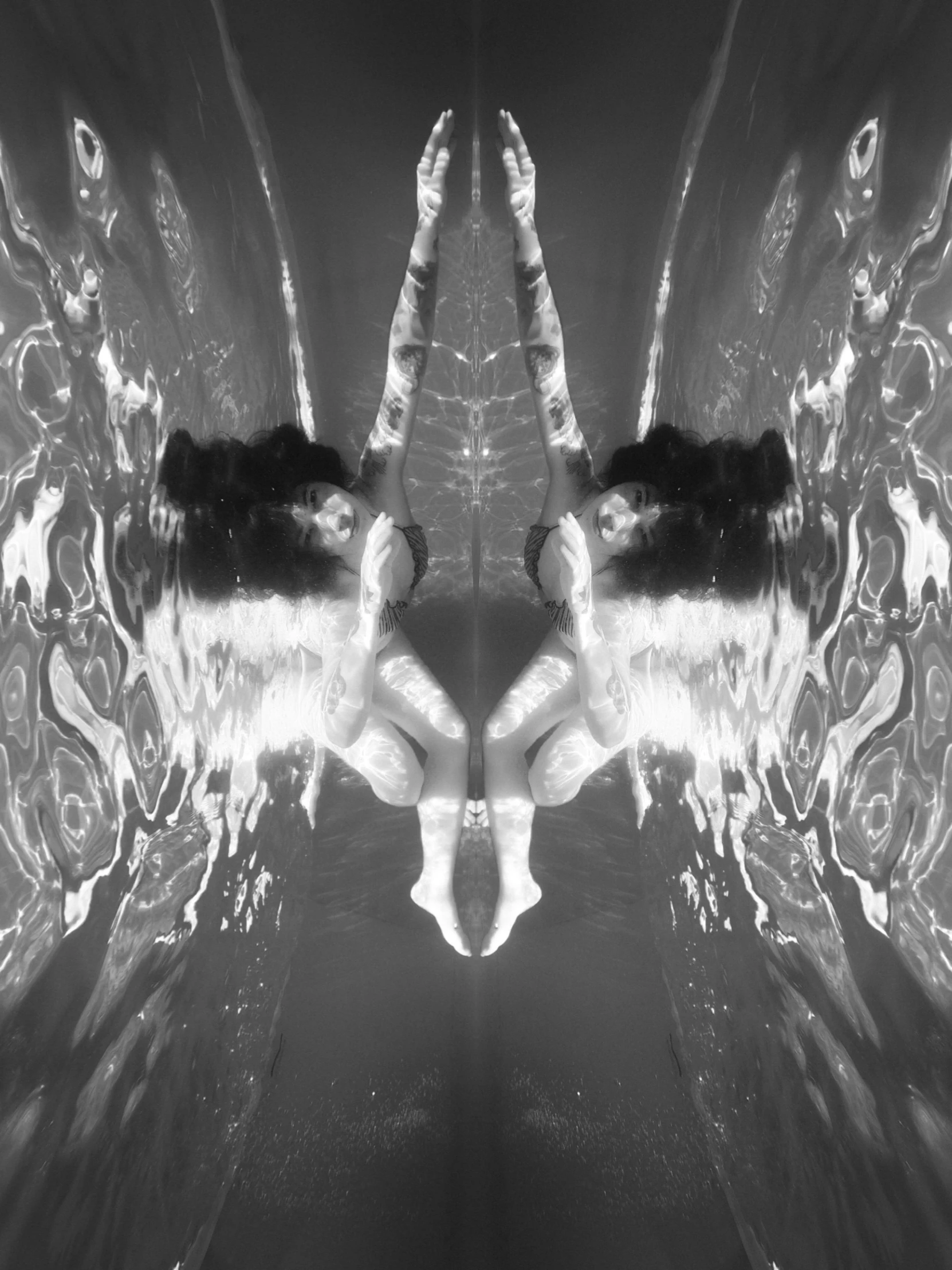 a black and white photo of two angel wings, a black and white photo, by Jan Rustem, conceptual art, water refractions!!, symmetrical portrait scifi, bathing in light, liquid cat