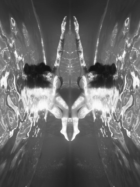 a black and white photo of two angel wings, a black and white photo, by Jan Rustem, conceptual art, water refractions!!, symmetrical portrait scifi, bathing in light, liquid cat