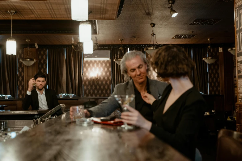 a group of people sitting at a bar drinking wine, a portrait, by Emma Andijewska, pexels contest winner, sad man, thumbnail, lounge, subtle details