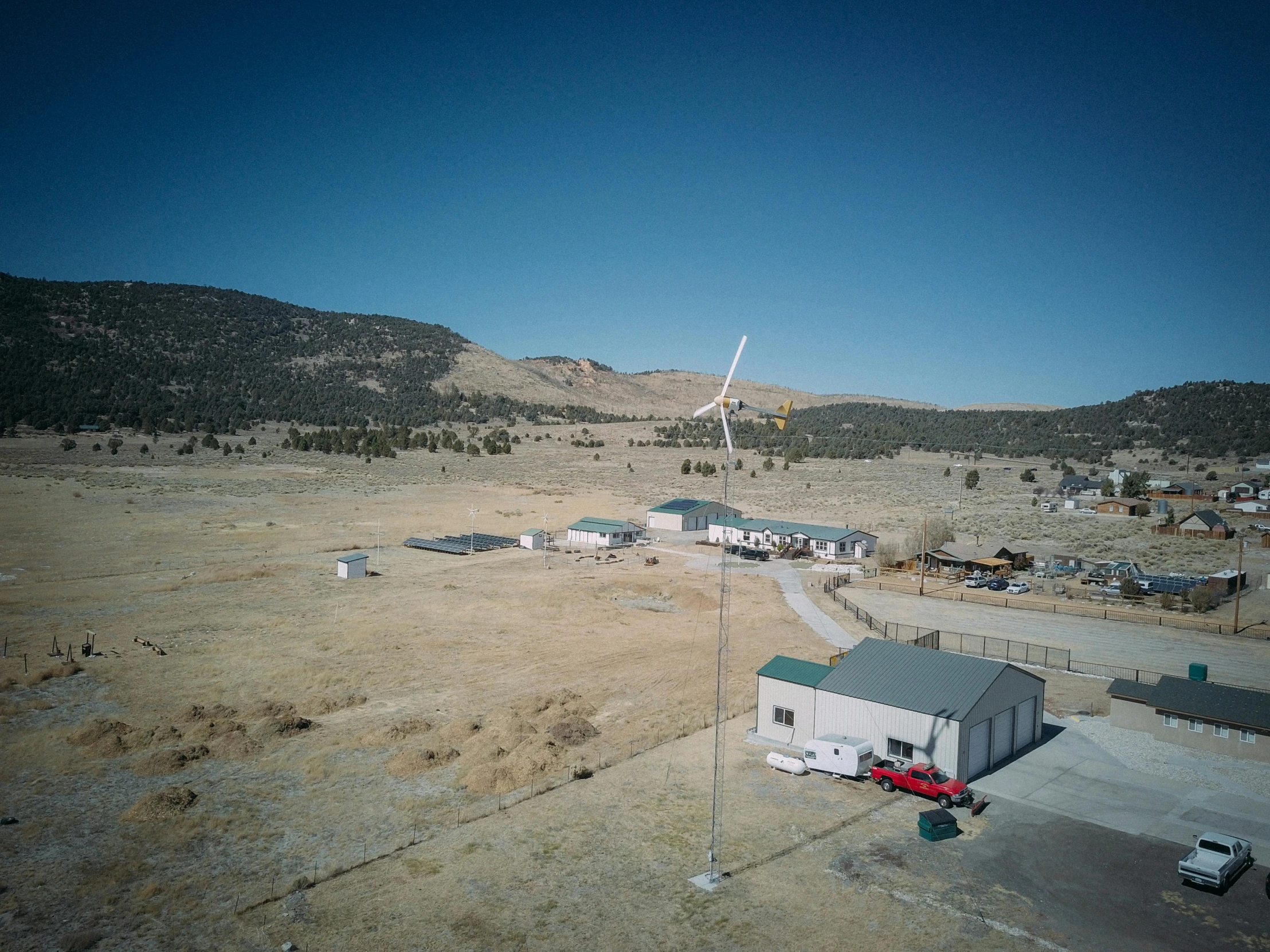 an aerial view of a small town in the desert, a portrait, unsplash, northwest school, turbines, 35 mm photo, 4k still, research station