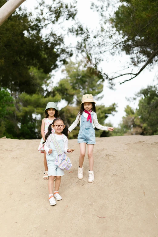 a couple of little girls walking down a dirt road, unsplash, gutai group, hill with trees, los angeles ca, playground, young asian girl